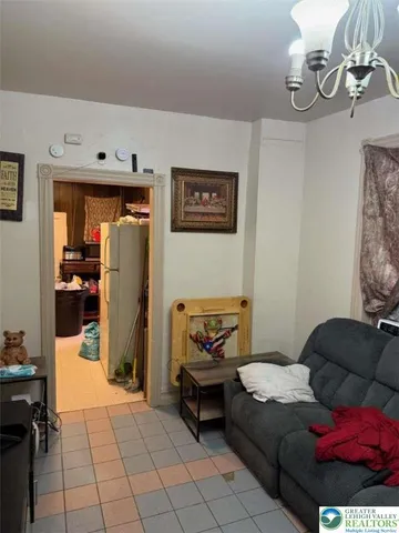 a kitchen with stainless steel appliances granite countertop a refrigerator a stove a sink dishwasher and a refrigerator