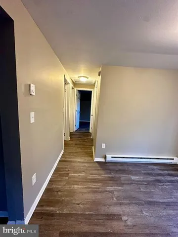 a view of a livingroom with wooden floor