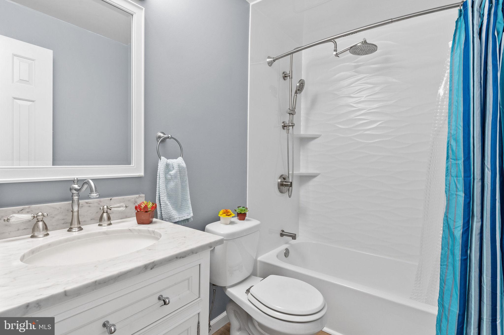 721 Webster Drive Monroeville, NJ 08343 - Photo 15 of 38 a bathroom with a sink a toilet and a bathtub