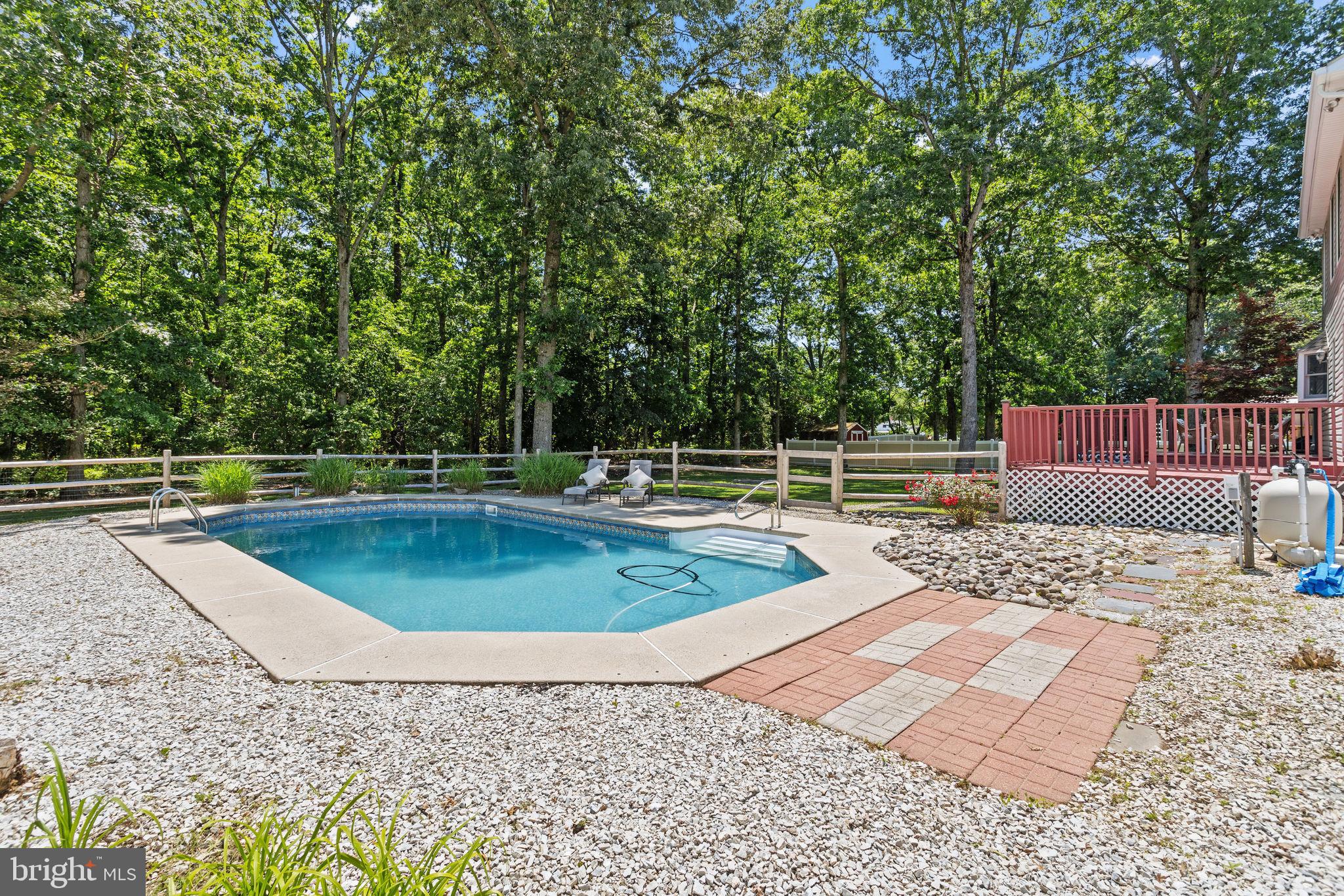 721 Webster Drive Monroeville, NJ 08343 - Photo 28 of 38 a view of a swimming pool with a lounge chair