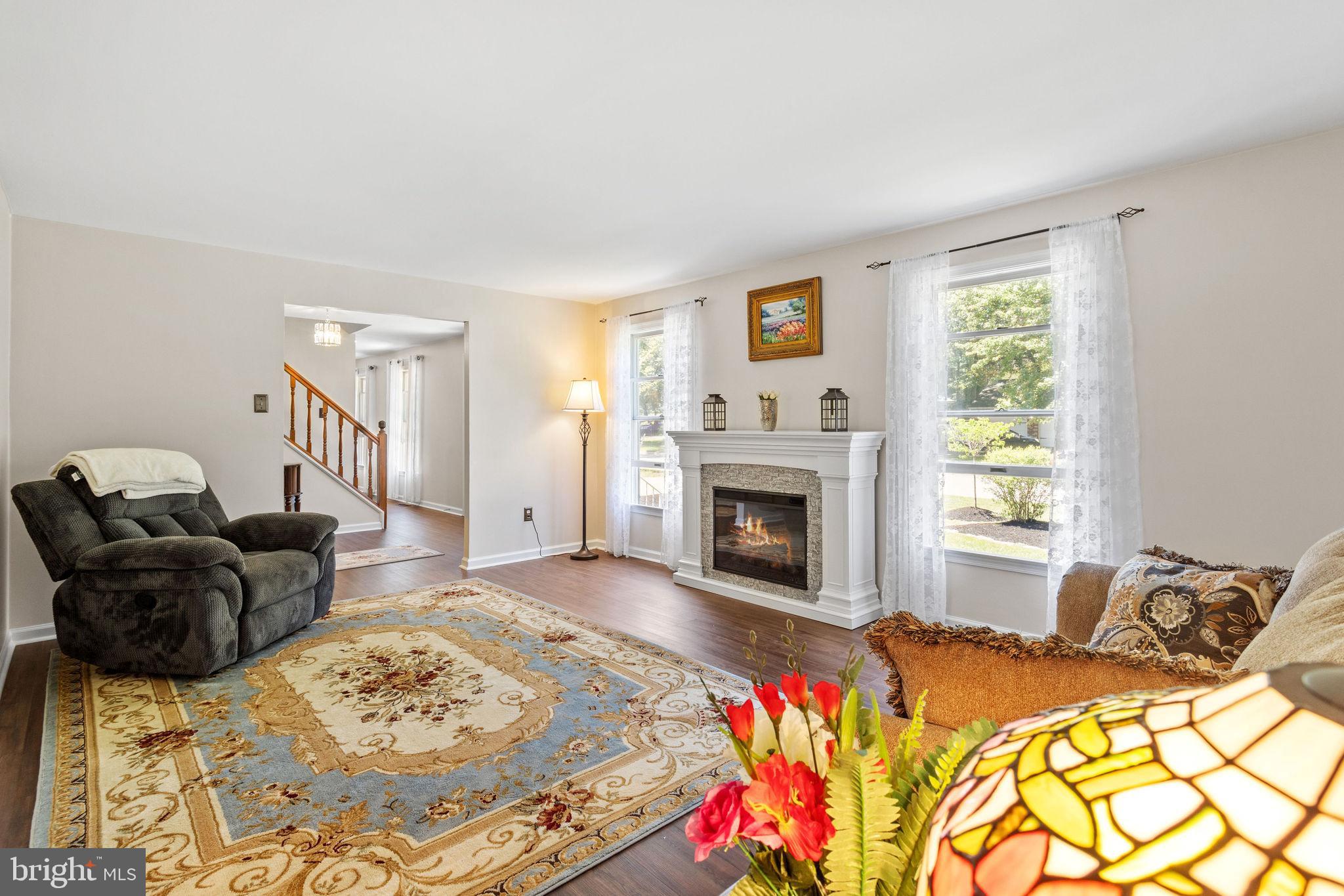 721 Webster Drive Monroeville, NJ 08343 - Photo 5 of 38 a bed room with a bed and a fireplace