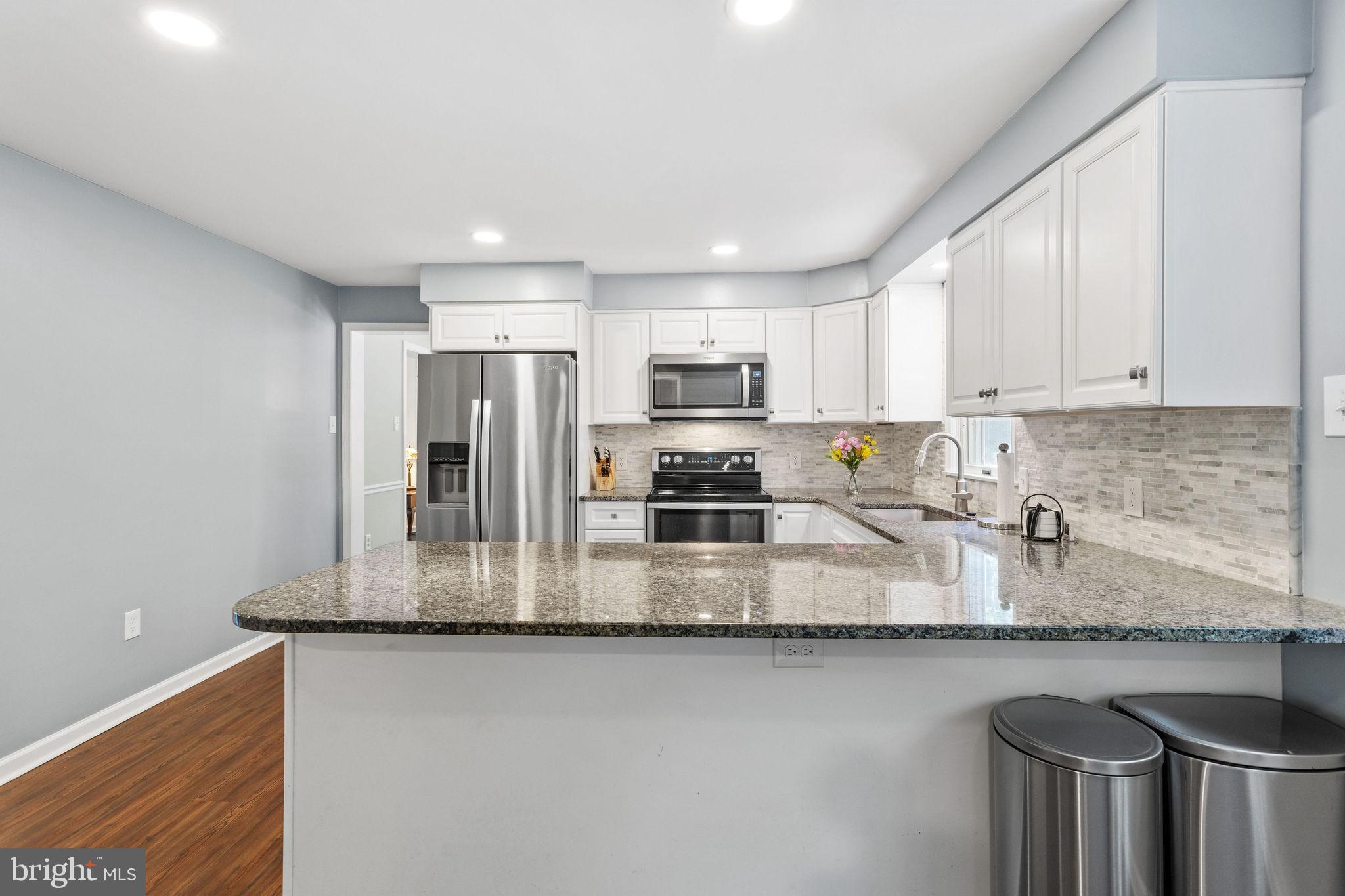 721 Webster Drive Monroeville, NJ 08343 - Photo 8 of 38 a kitchen with stainless steel appliances granite countertop a sink refrigerator and cabinets