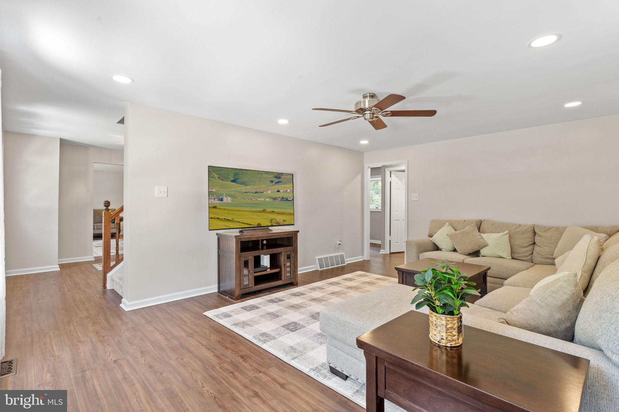 721 Webster Drive Monroeville, NJ 08343 - Photo 10 of 38 a living room with furniture and a fireplace