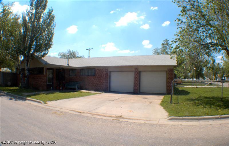 4101 South Monroe Street Amarillo, TX 79110 - Photo 1 of 6 a front view of a house with a yard and a garage