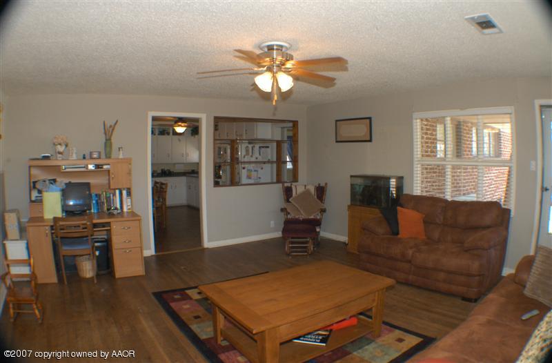 4101 South Monroe Street Amarillo, TX 79110 - Photo 2 of 6 a living room with furniture a table and a window