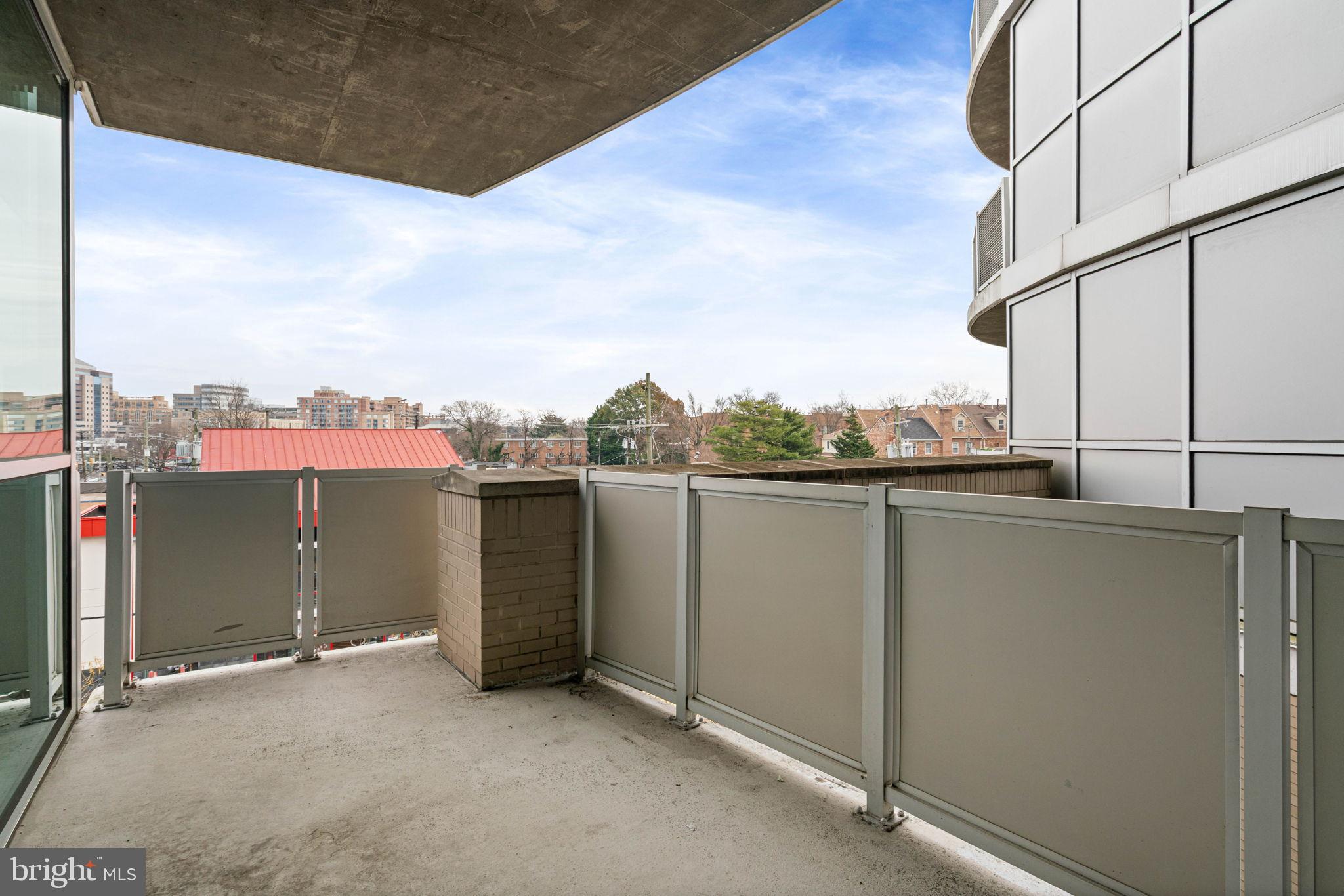 3409 Wilson Boulevard, Unit 301 Arlington, VA 22201 - Photo 13 of 39 Modern balcony with city skyline views.