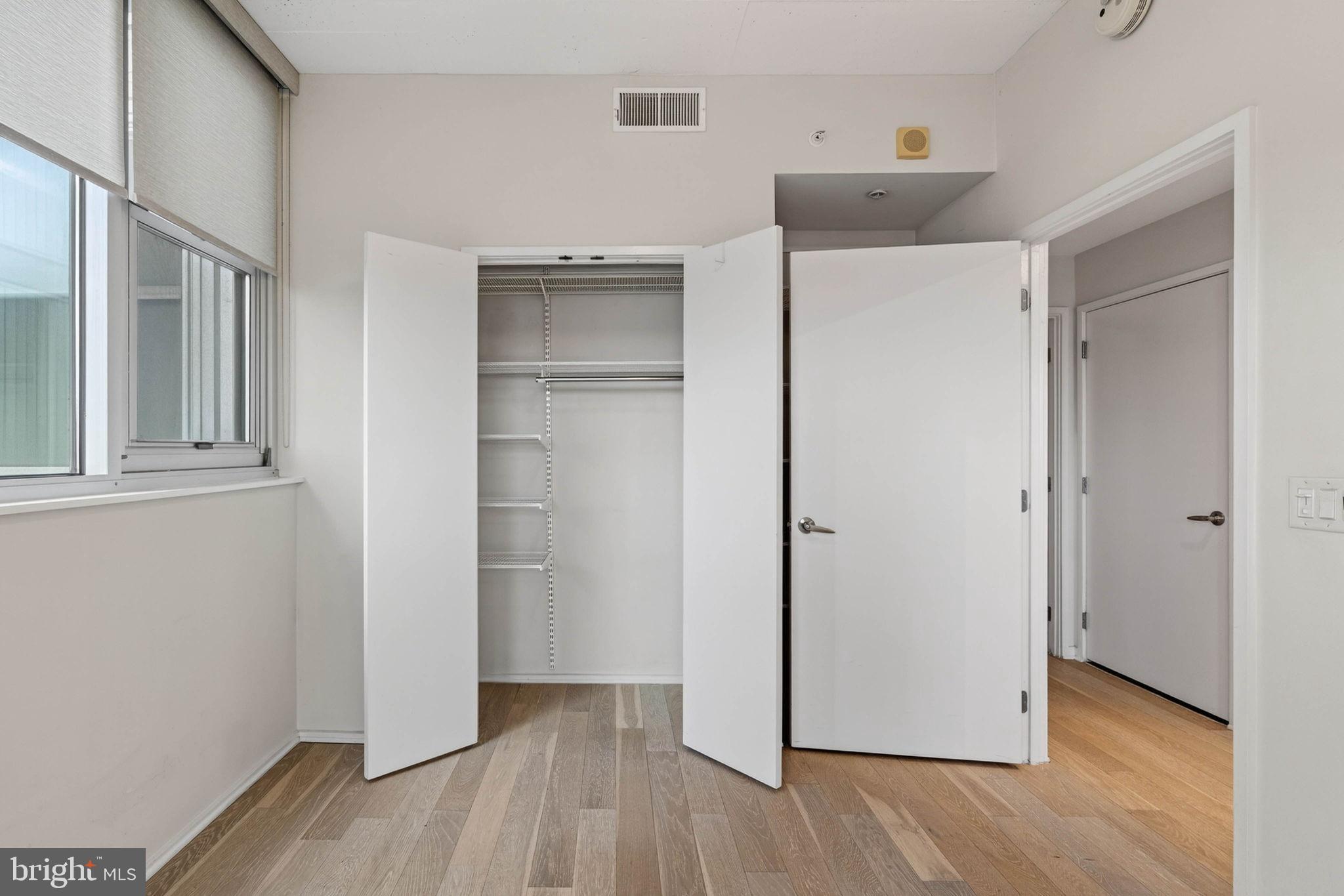 3409 Wilson Boulevard, Unit 301 Arlington, VA 22201 - Photo 21 of 39 a view of a room with wooden floor