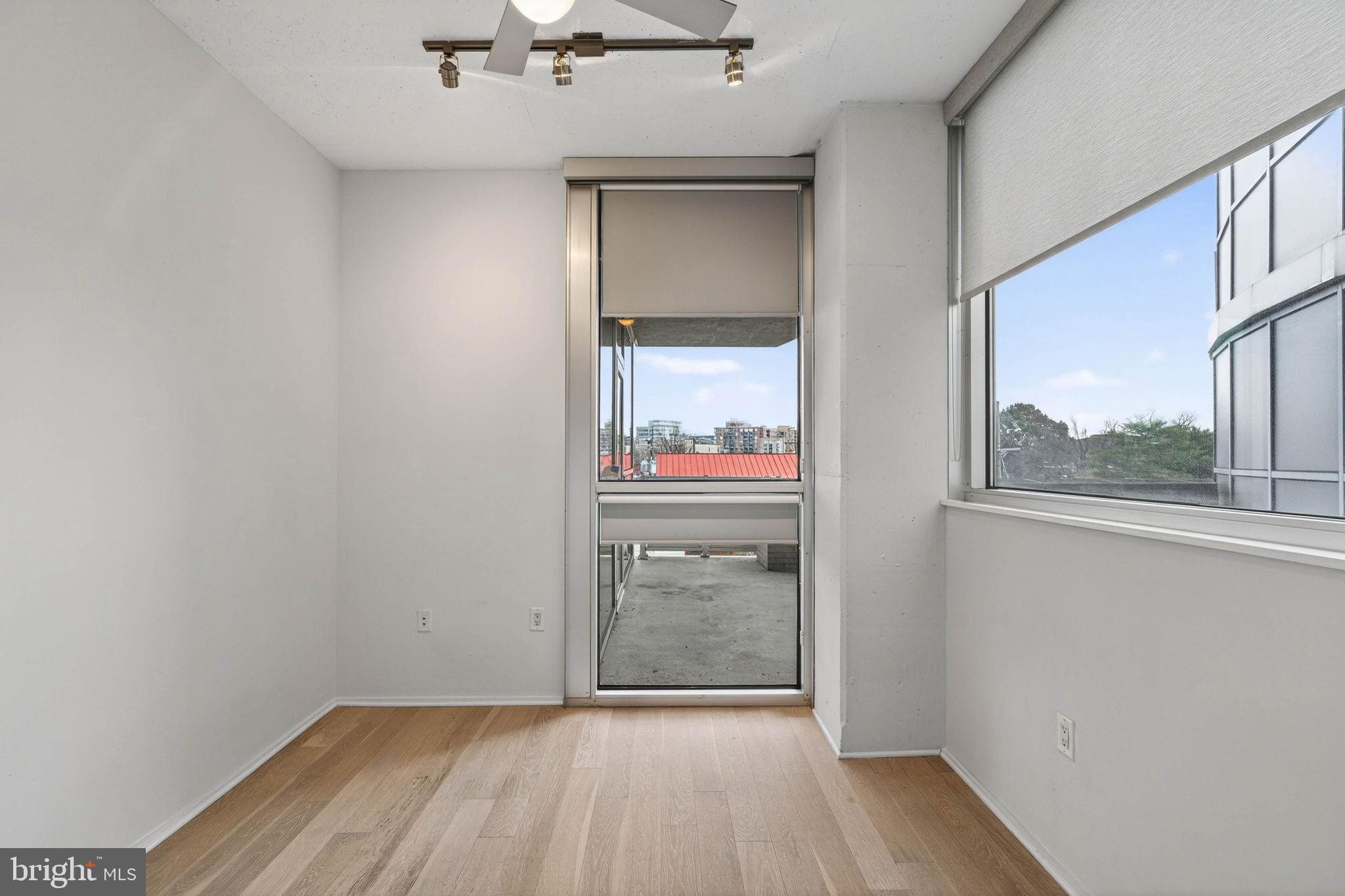 3409 Wilson Boulevard, Unit 301 Arlington, VA 22201 - Photo 22 of 39 wooden floor in an empty room with a window