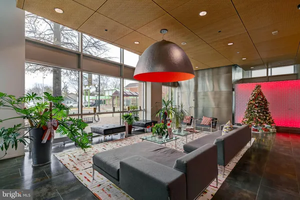 a kitchen with stainless steel appliances granite countertop a sink refrigerator and microwave