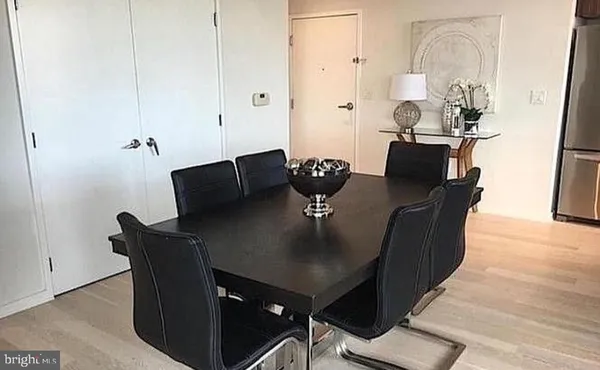 a bedroom with a bed and a mirror