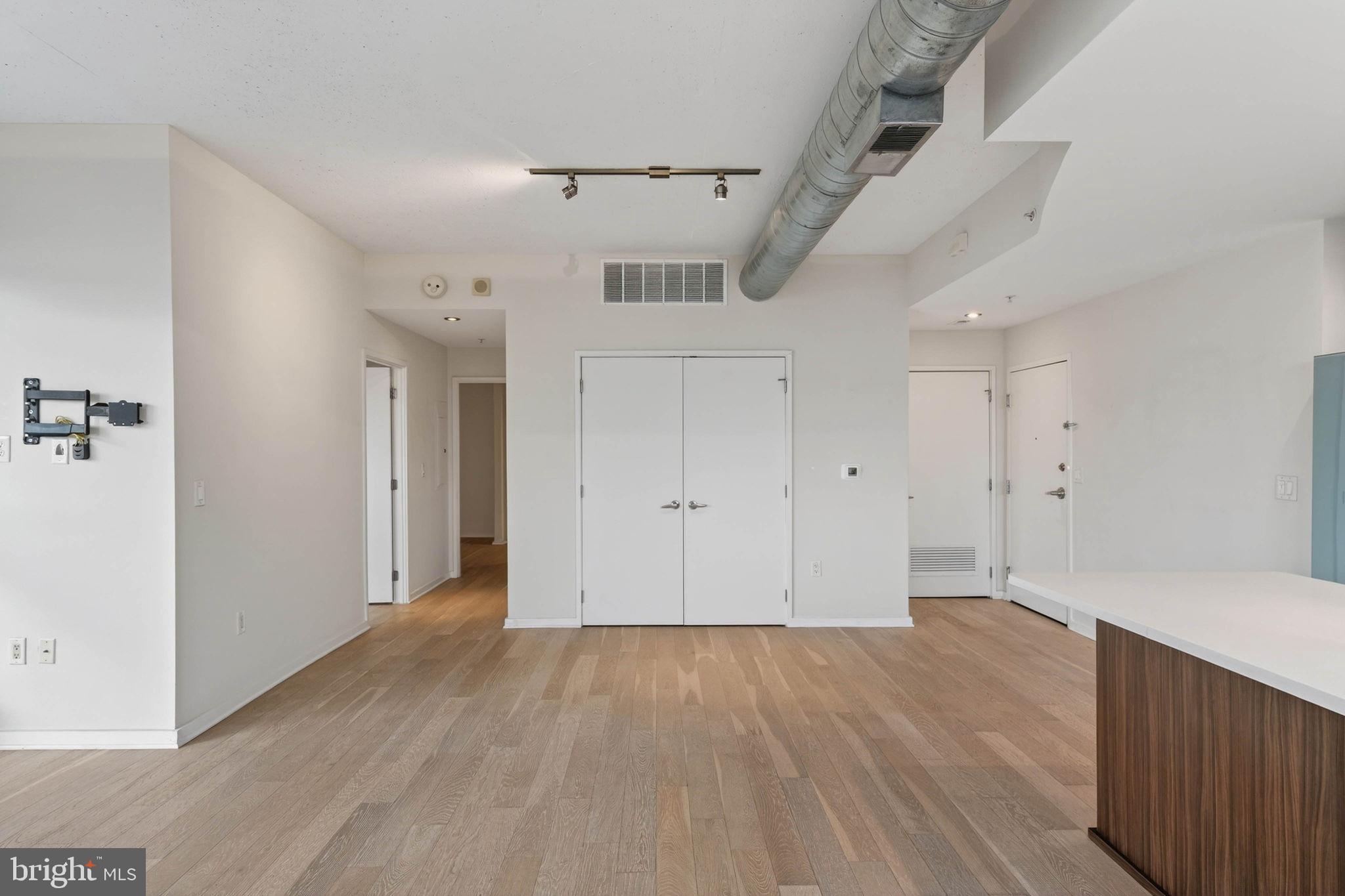 3409 Wilson Boulevard, Unit 301 Arlington, VA 22201 - Photo 10 of 39 wooden floor in an empty room