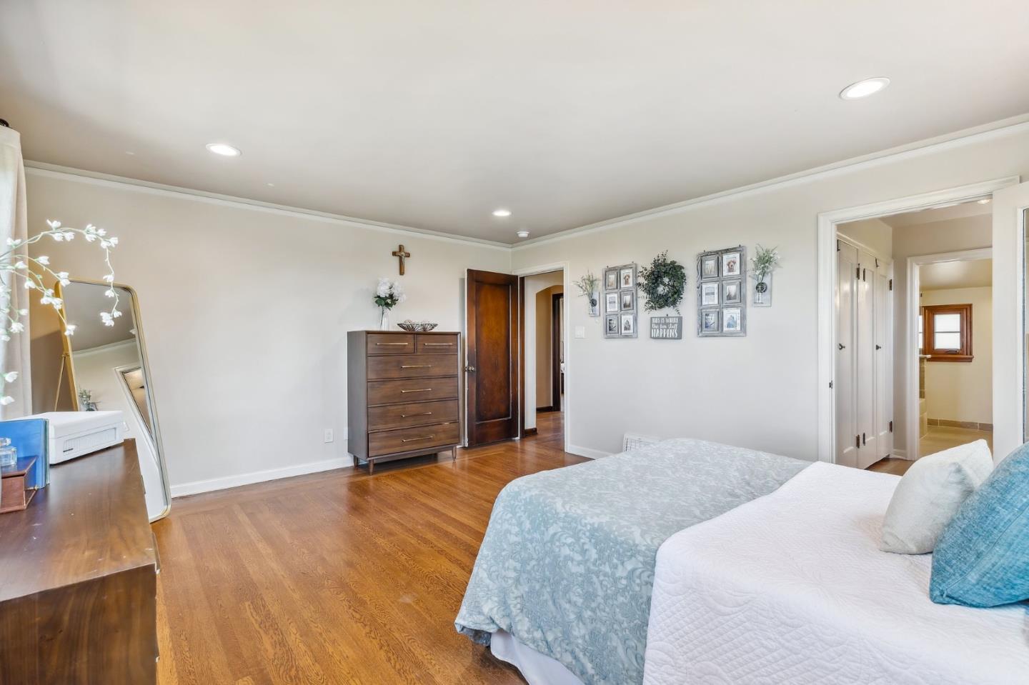 333 Crest Drive San Jose, CA 95127 - Photo 41 of 69 a bedroom with a bed dresser and a wooden floor