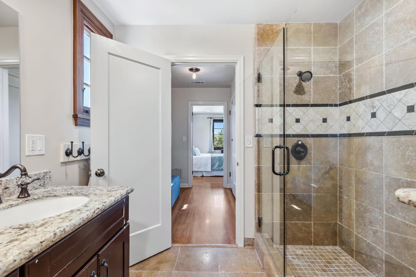 333 Crest Drive San Jose, CA 95127 - Photo 44 of 69 a bathroom with a granite countertop shower a sink and a mirror