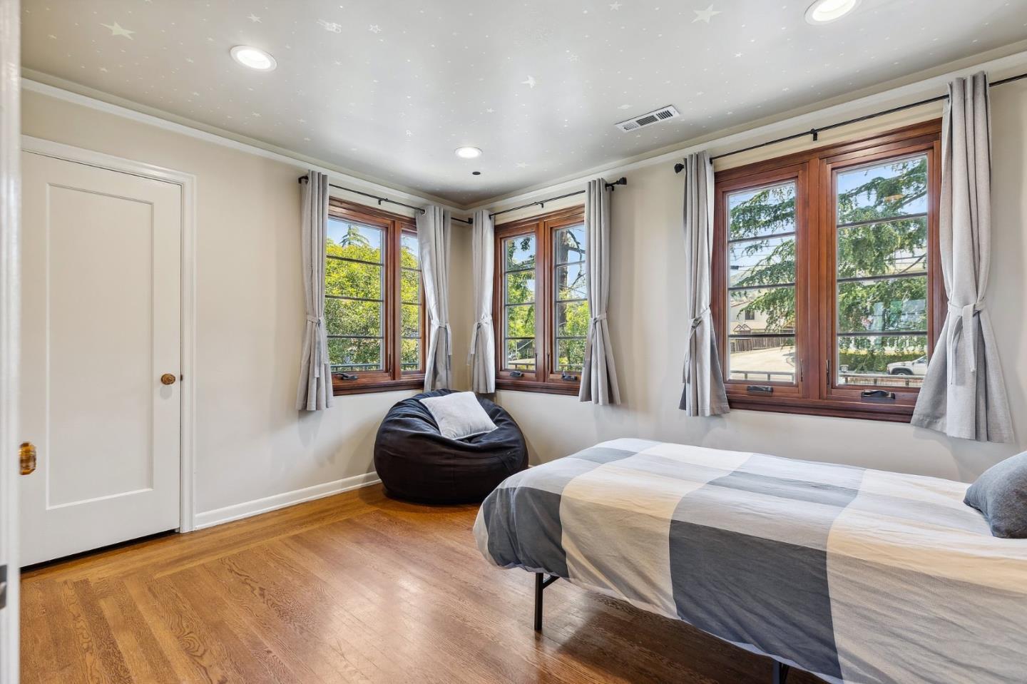 333 Crest Drive San Jose, CA 95127 - Photo 46 of 69 a spacious bedroom with a large bed and a large window