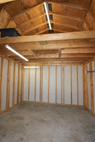 a view of house with backyard and sitting area