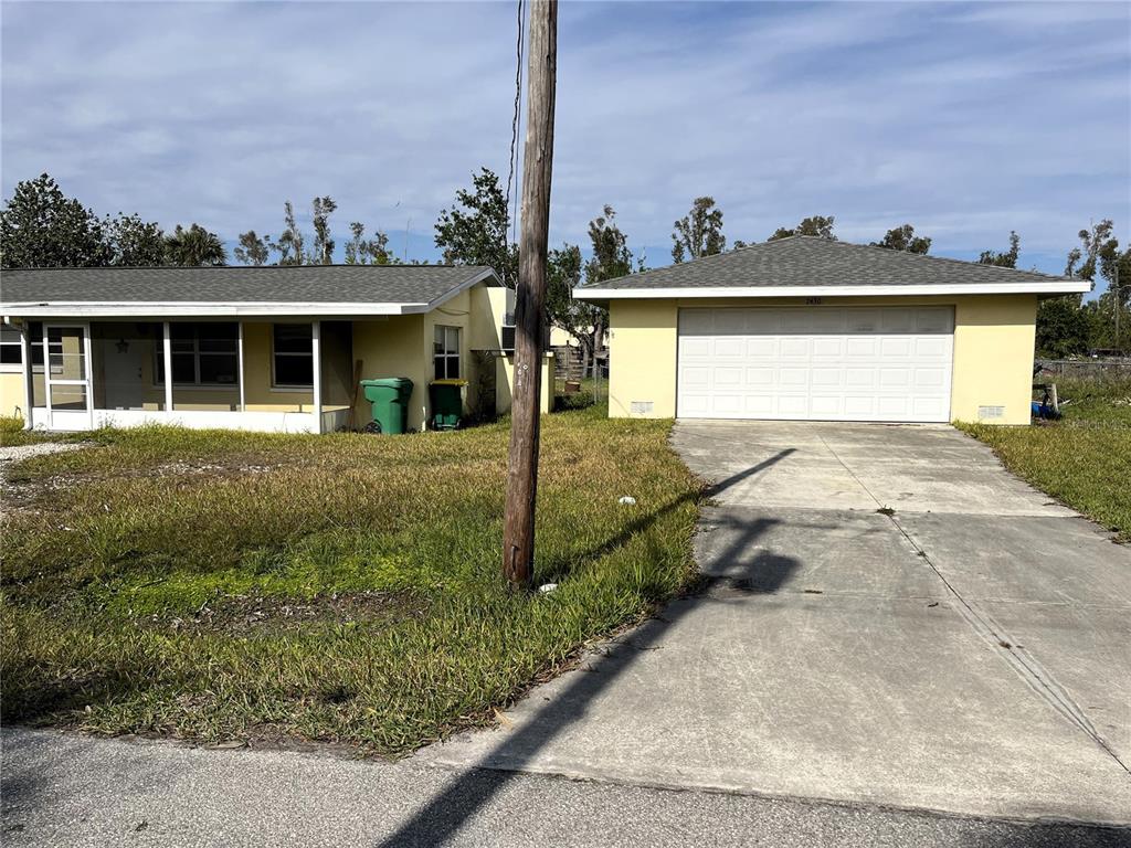 2430 Dixie Avenue Punta Gorda, FL 33950 - Photo 1 of 1 front view of a house with a yard