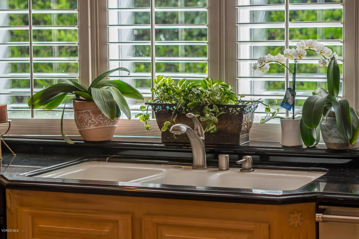 11112 Red Barn Road Camarillo, CA 93012 - Photo 18 of 54 a closeup of a sink with a granite floor and potted plant