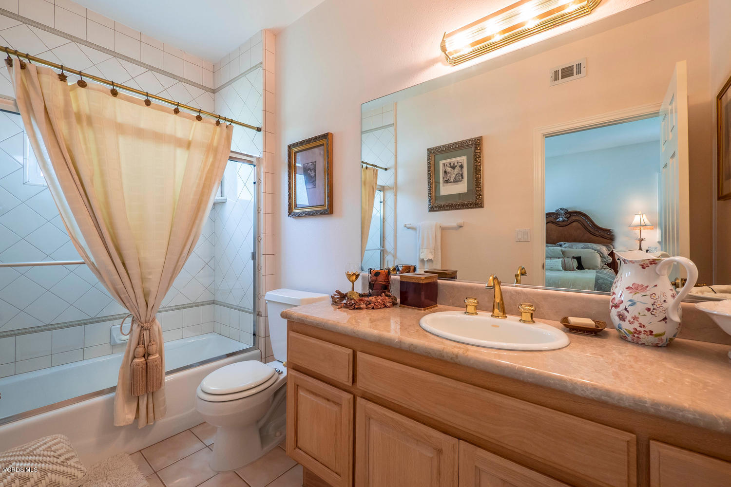 11112 Red Barn Road Camarillo, CA 93012 - Photo 31 of 54 a bathroom with a toilet a sink and a mirror