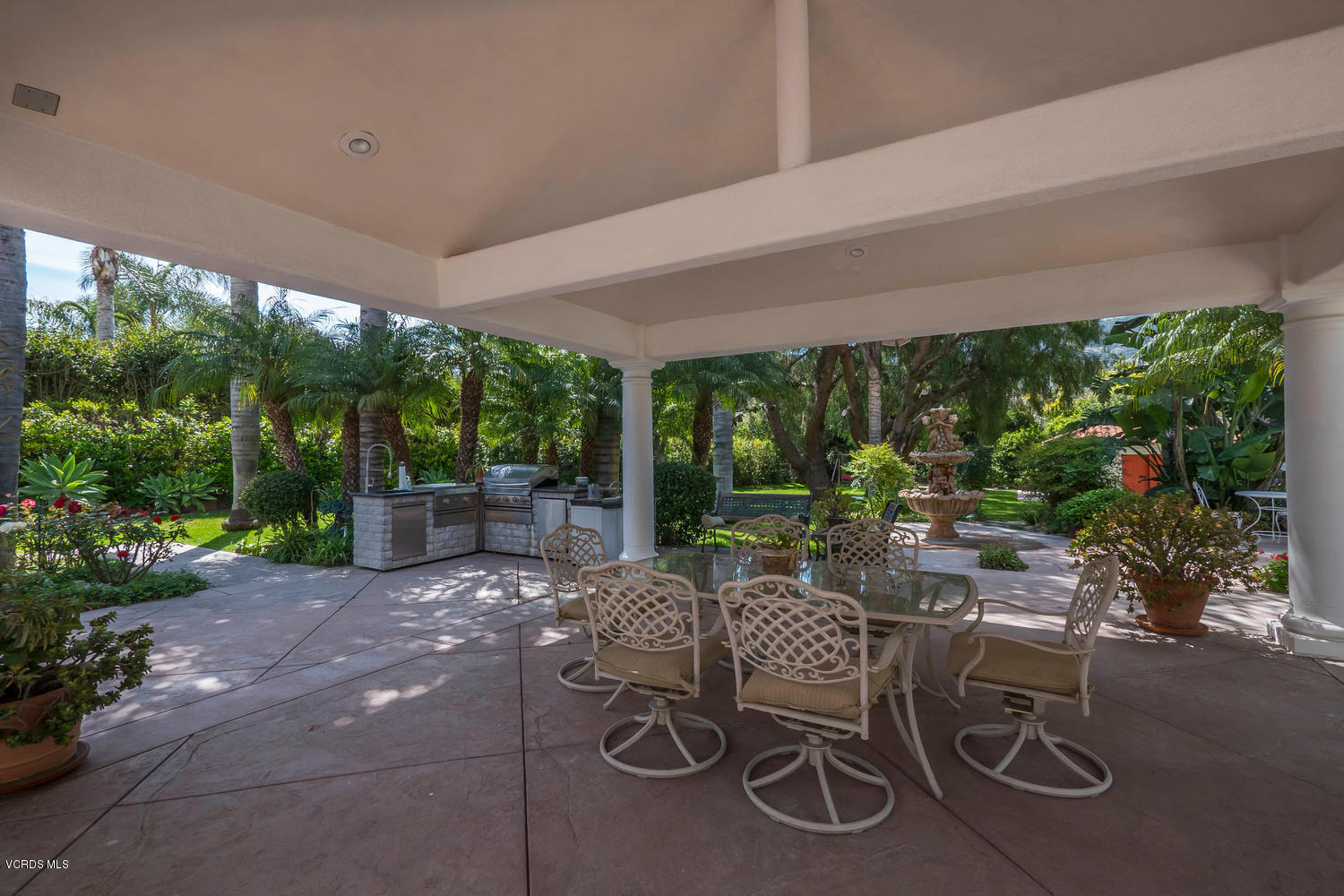 11112 Red Barn Road Camarillo, CA 93012 - Photo 42 of 54 a patio with yard glass top table and chairs