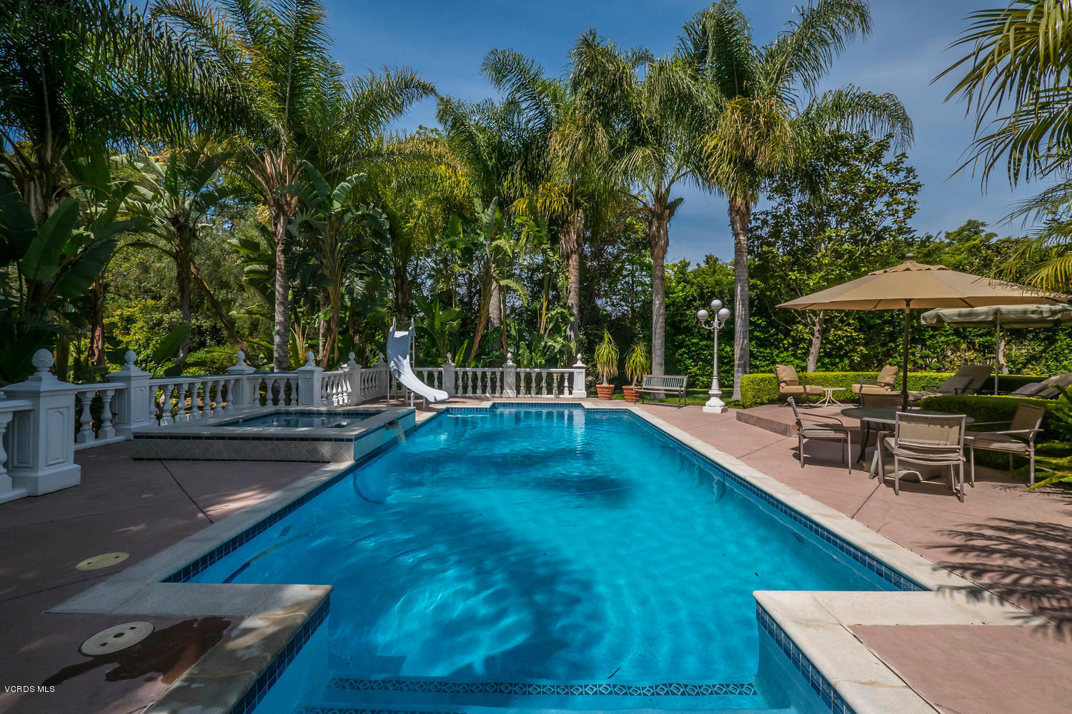 11112 Red Barn Road Camarillo, CA 93012 - Photo 44 of 54 a view of a swimming pool with chairs in patio