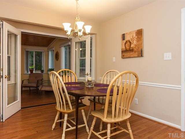 5116 Six Point Trail Raleigh, NC 27616 - Photo 4 of 18 a view of a dining room with furniture wooden floor and chandelier