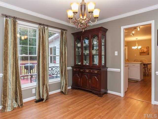 5116 Six Point Trail Raleigh, NC 27616 - Photo 5 of 18 an empty room with wooden floor and windows