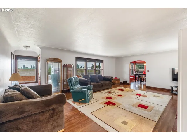 a living room with furniture and next to a window