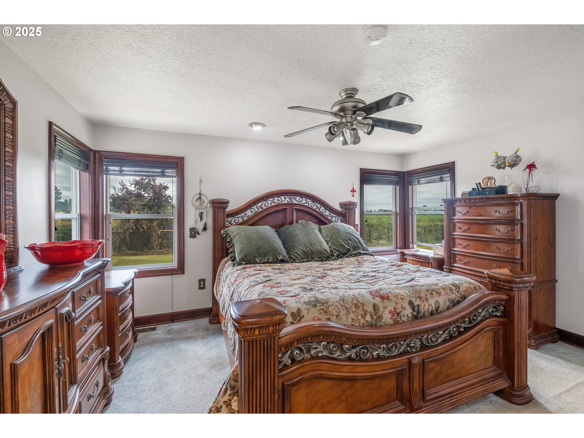 8758 Stayton Road Southeast Turner, OR 97392 - Photo 19 of 39 a bed room with a bed and a chandelier