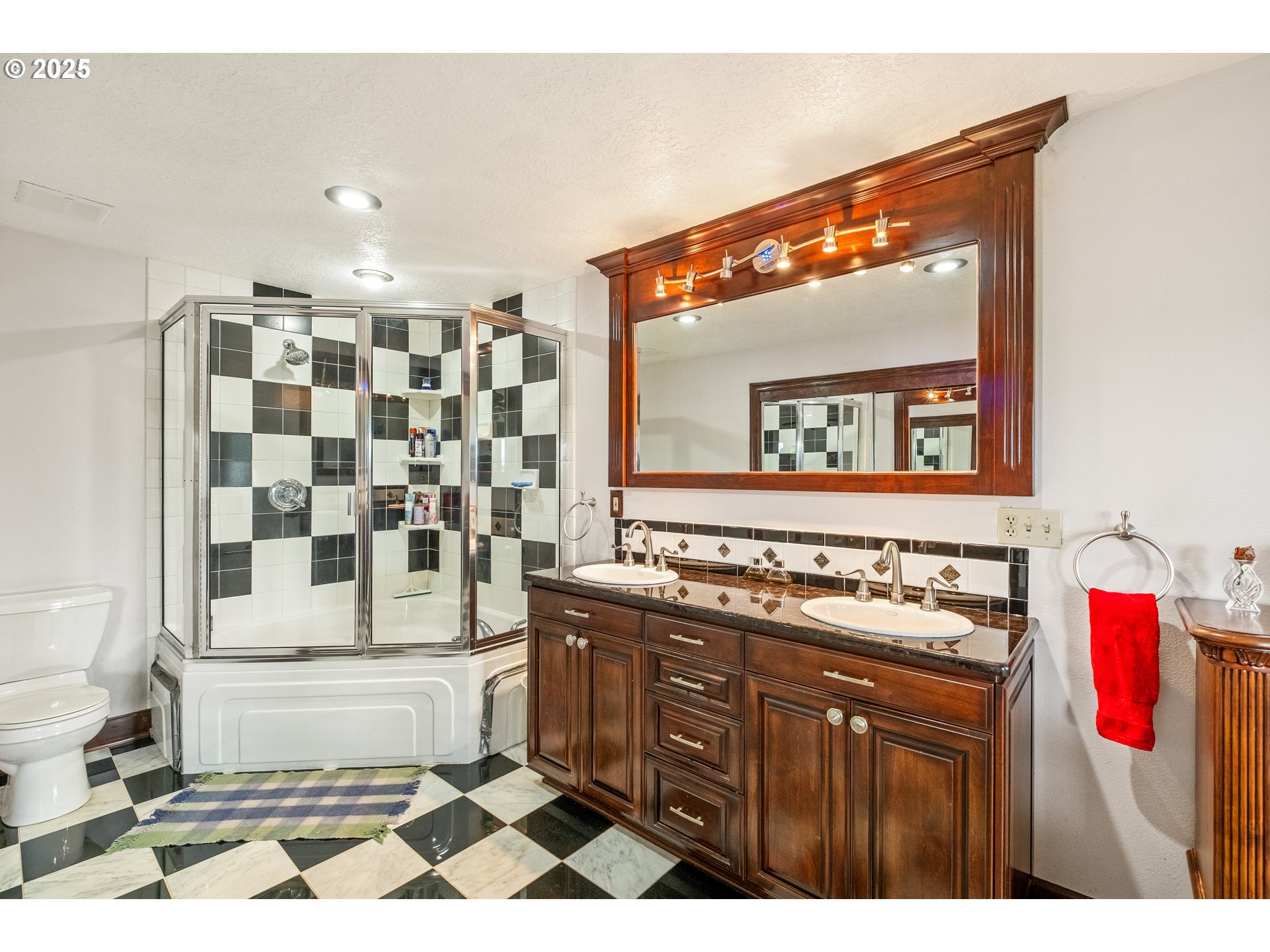 8758 Stayton Road Southeast Turner, OR 97392 - Photo 21 of 39 a bathroom with a sink a vanity and a mirror