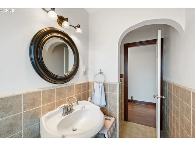 a bathroom with a sink a mirror and a toilet