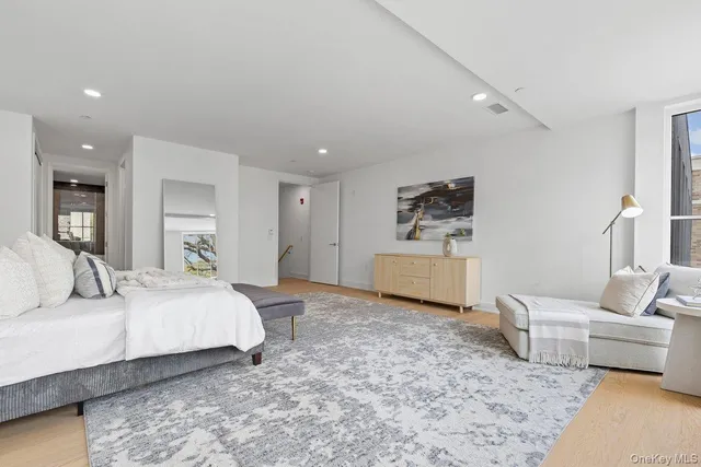 a bedroom with a bed and a couch