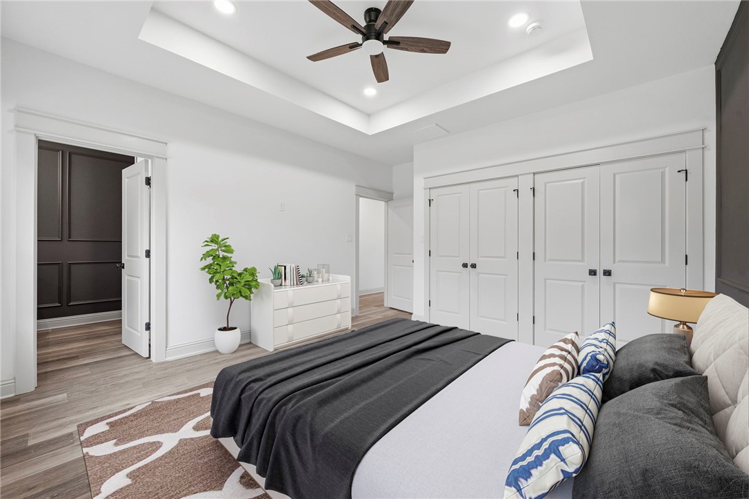 505 Legion Court Bryan, TX 77803 - Photo 9 of 21 a bedroom with a bed and ceiling fan