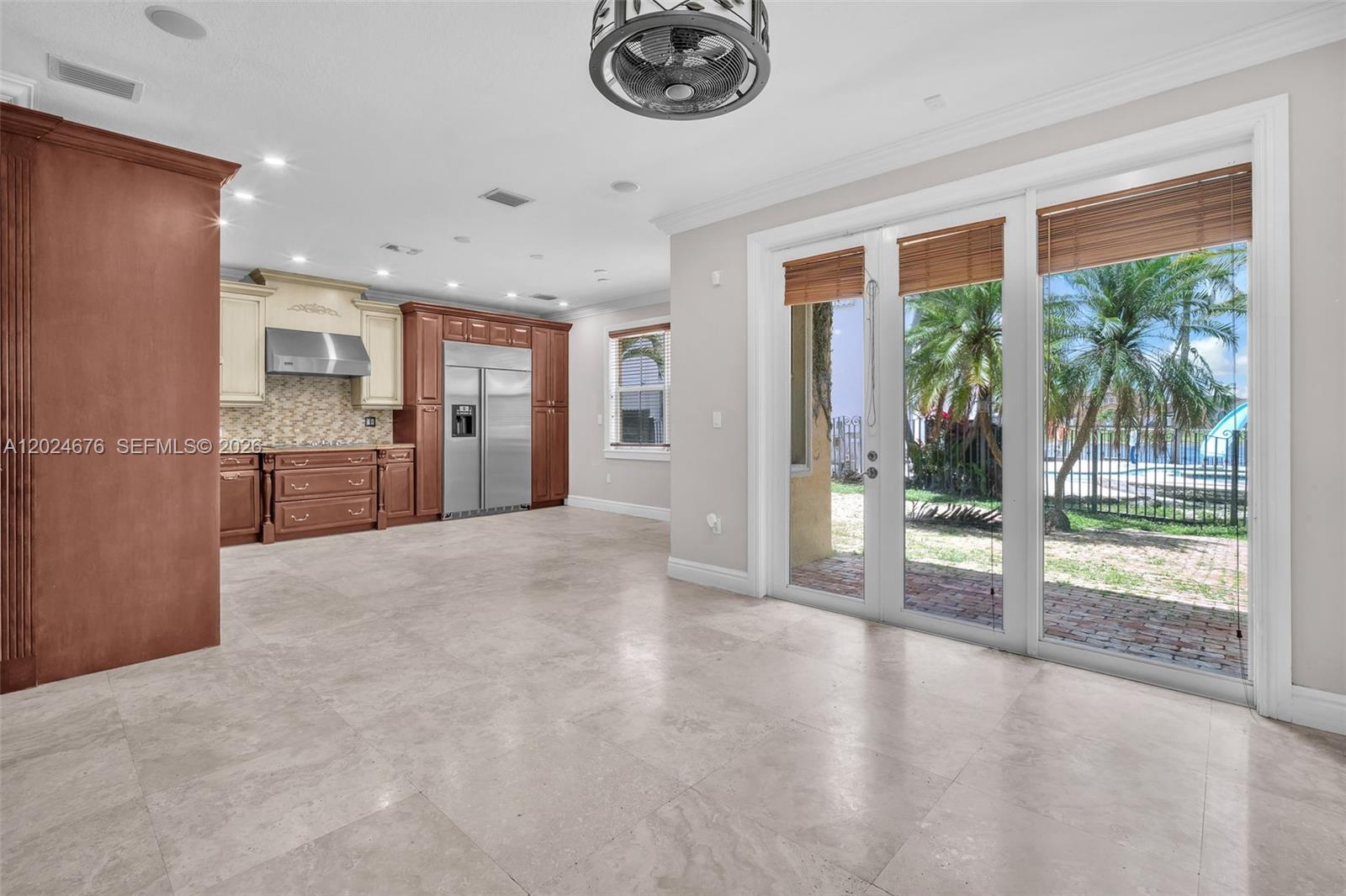 2155 Southwest 156th Court Miami, FL 33185 - Photo 9 of 57 a view of livingroom with kitchen view and floor to ceiling window