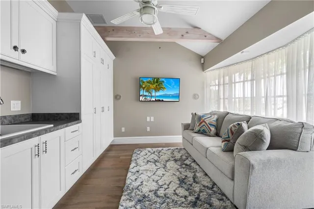 a living room with furniture and a rug