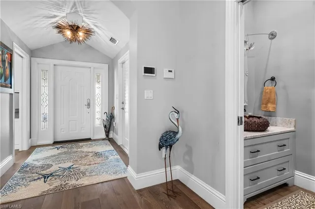 a room that has a bed and a dresser in it