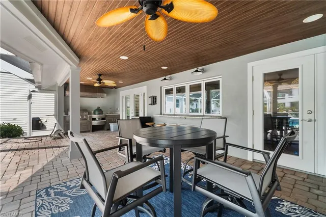 a view of a room with furniture and wooden floor