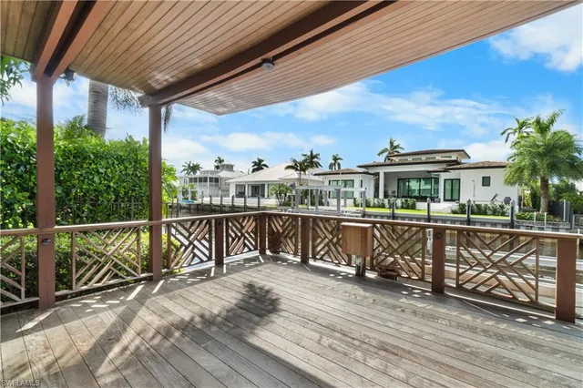 a view of a balcony with wooden floor