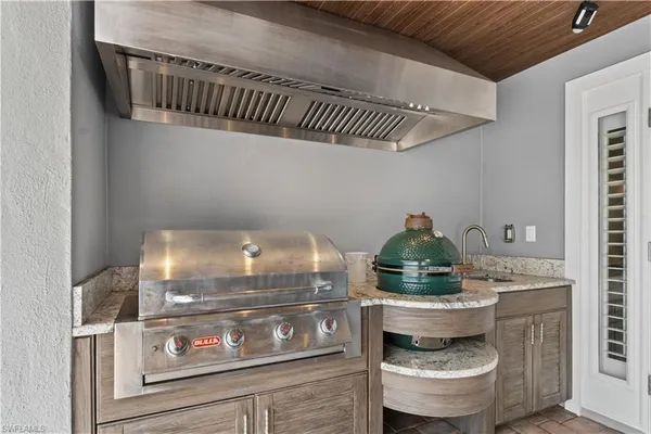 a kitchen with a stove and cabinets