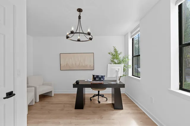 a workspace with furniture and a window