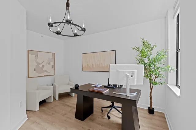 a view of a workspace with furniture