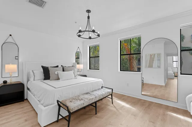 a bedroom with bed and window