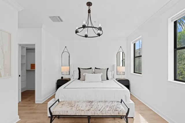 a bedroom with a bed and window