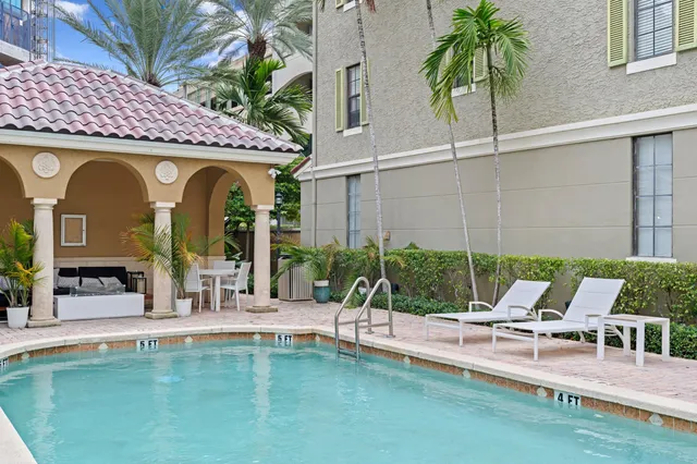 a view of a chairs and table in patio