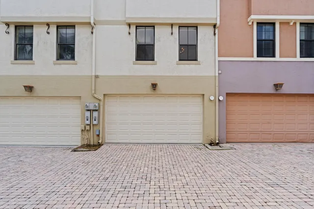 a front view of a building with parking space