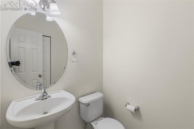 5359 Gentle Wind Road Colorado Springs, CO 80922 - Photo 15 of 36 half bath on main