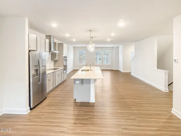 a view of a living room with wooden floor
