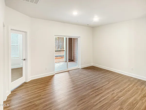 an empty room with sliding door