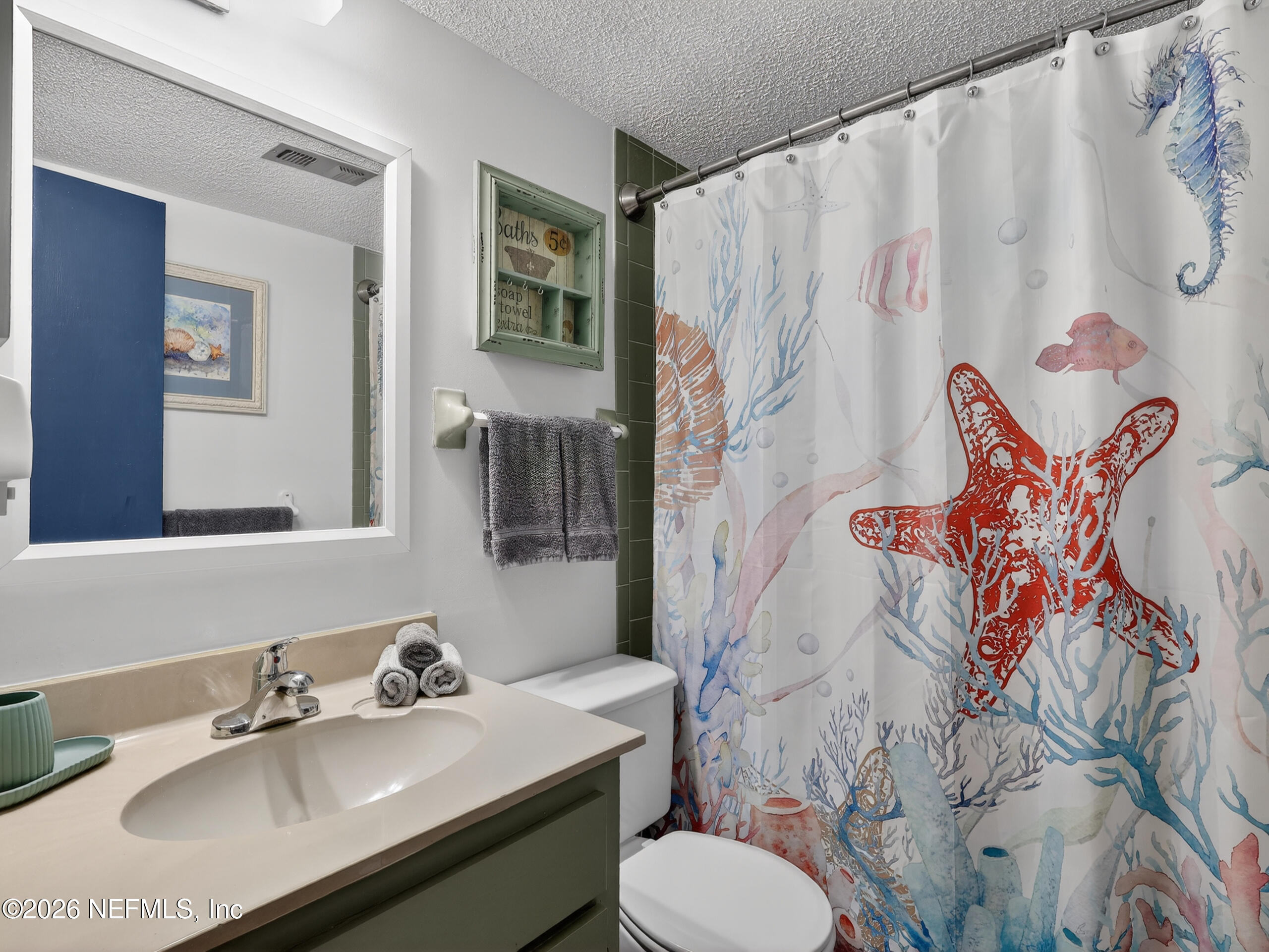 1 Ocean Trace Road, Unit 230 St. Augustine Beach, FL 32080 - Photo 25 of 50 a bathroom with a sink toilet and shower