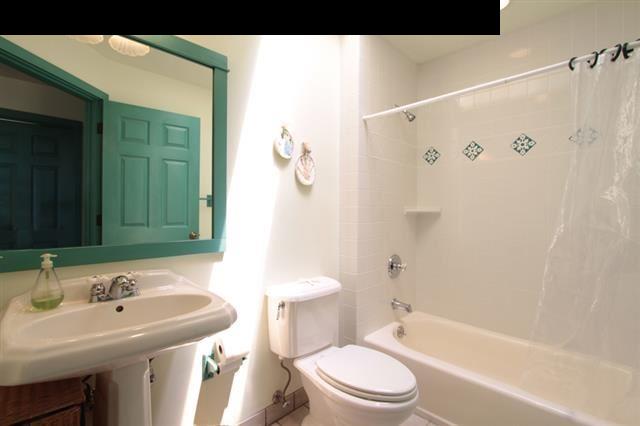 260 Awalau Road Haiku, HI 96708 - Photo 14 of 30 a bathroom with a sink a toilet and shower