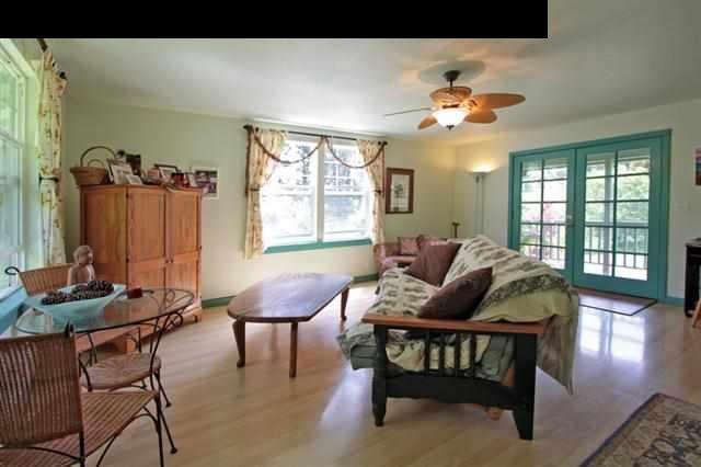 260 Awalau Road Haiku, HI 96708 - Photo 26 of 30 a living room with furniture and a large window